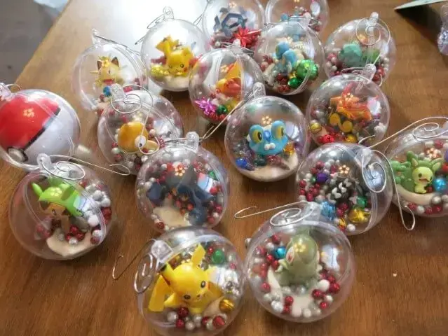 Transparent Christmas balls with pokémon dolls Photo by Cindy Kohler