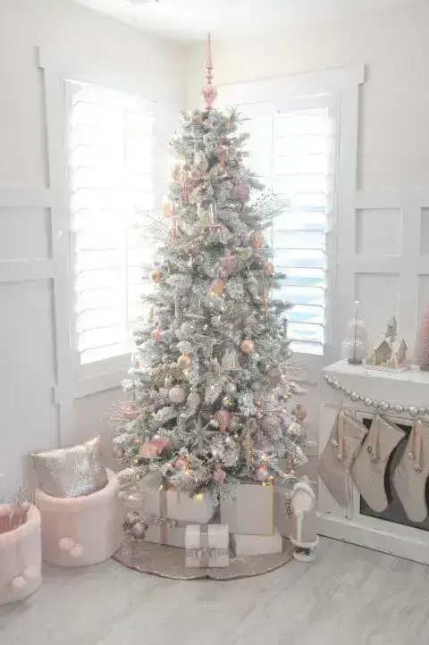 White Christmas tree with pink ornaments Photo by Pinterest