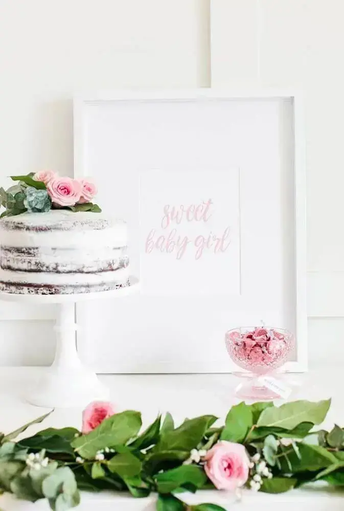 table decorated with cake and flowers for baby tea girl Photo The Search Titans