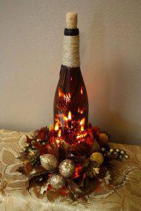 arranjos de natal para mesa garrafa de champanhe e luzes