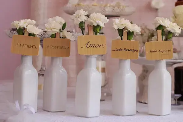 Spread bottles with flowers around the party room