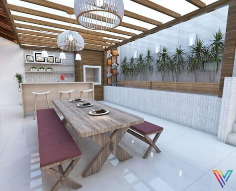 Casa com varanda gourmet com mesa e bancos de madeira Projeto de Fernanda Pereira