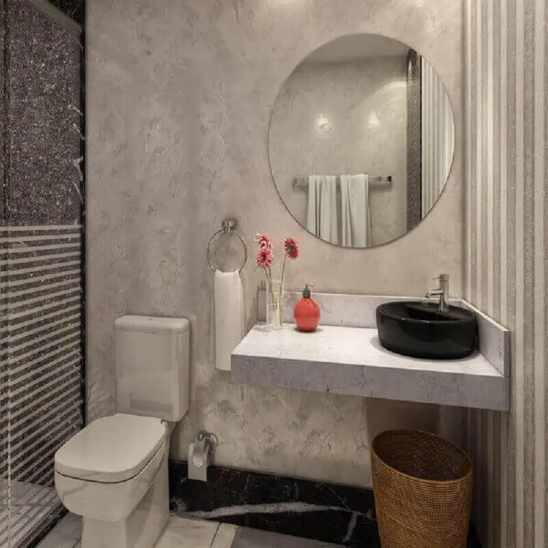 decoração moderna com bancada de banheiro de mármore com cuba redonda preta Foto Assetproject