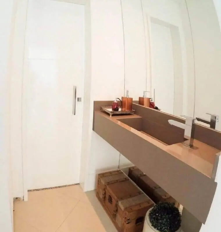 decoração simples para banheiro com pia esculpida em silestone Foto Arquitetura AEC
