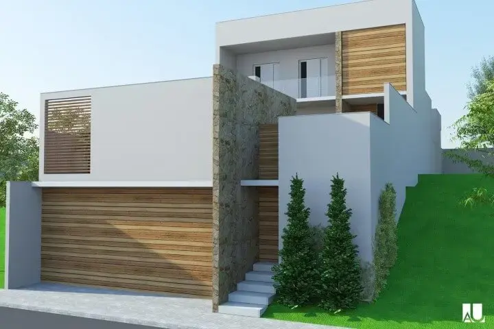 Casa moderna com muro de pedras e portão de madeira Projeto de Espaço AU