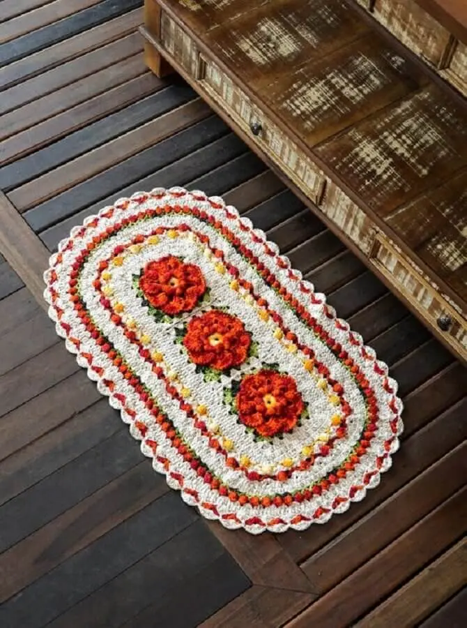 tapete crochê oval com flor laranja Foto Croche Supreme