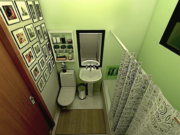 Banheiro pequeno decorado com parede verde