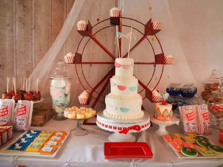 decoration for birthday party with toy Ferris wheel on the table Photo With silk hands