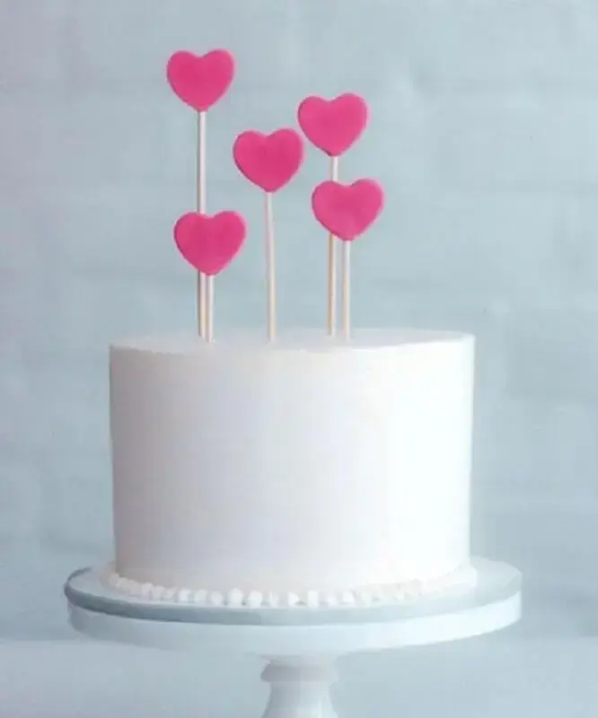 simple cake decoration with heart plaques on top Photo A Thousand Mom Tips