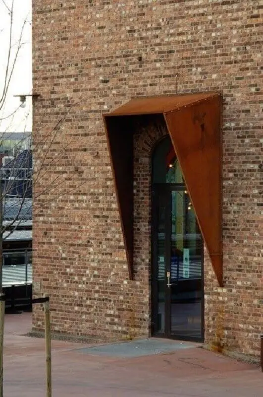 fachada de tijolo à vista com detalhe em aço corten Foto The Wizard Life