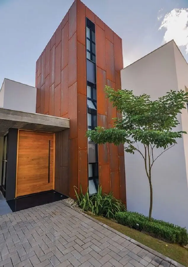 fachada moderna feita com cimento queimado e aço corten Foto Pinterest