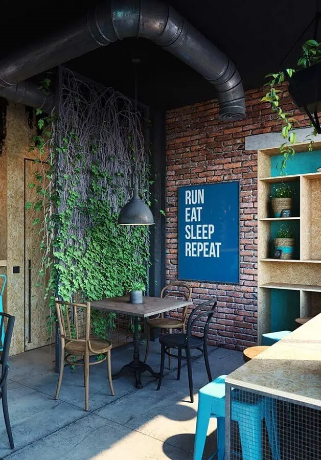 decoração estilo industrial para ambiente com parede de tijolinho e quadro azul petróleo Foto Pinterest