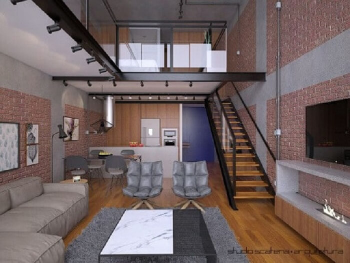 Loft industrial com sala com escada e cozinha americana