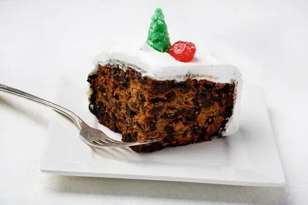 Piece of Christmas cake with chocolate filling