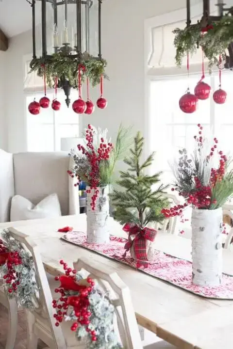 Christmas dinner table with ornaments in the luminaries