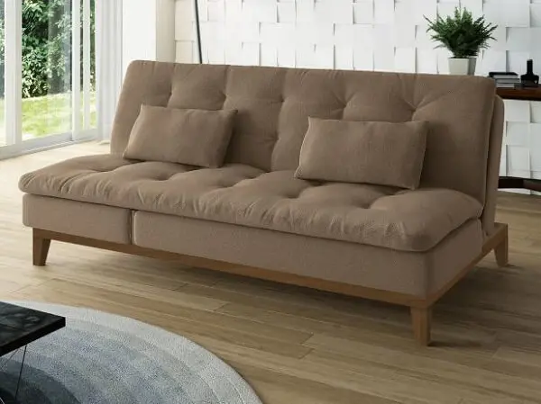 Sofá cama suede em tom marrom com pés de madeira