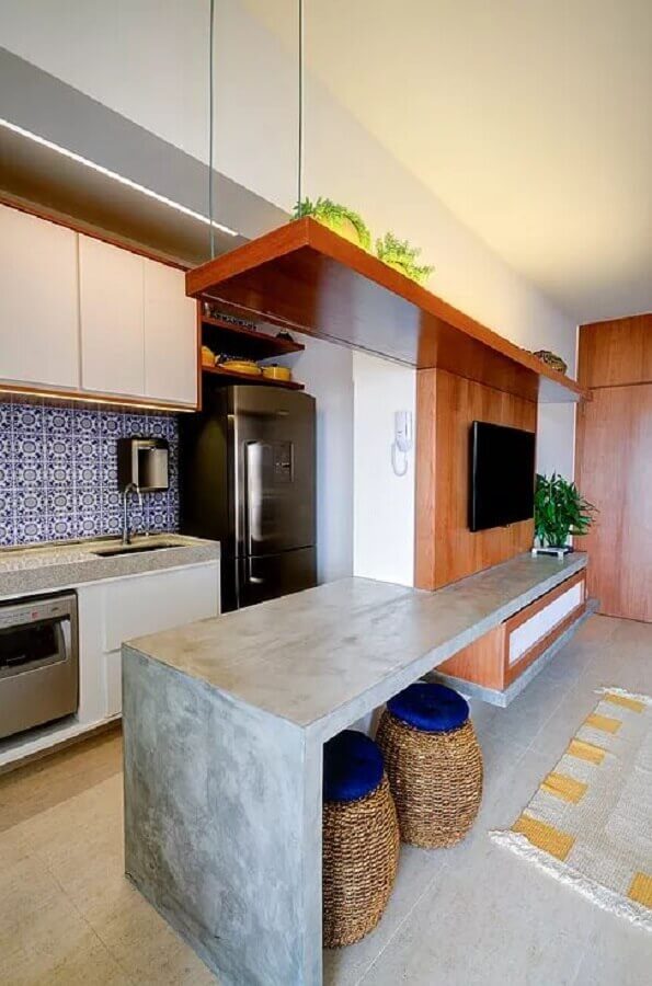 cozinha com bancada de concreto integrada com sala de estar Foto Manual da Obra