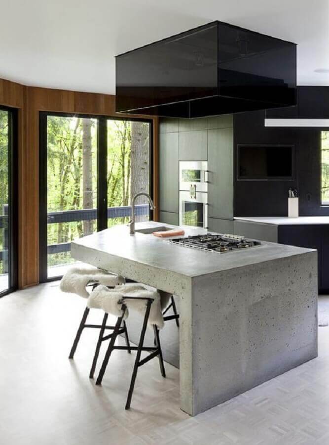cozinha moderna com bancada de concreto e cooktop Foto Pinterest