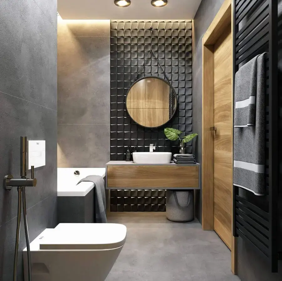 decoração moderna para banheiro preto e cinza com revestimento 3d e espelho redondo Foto JolyGram