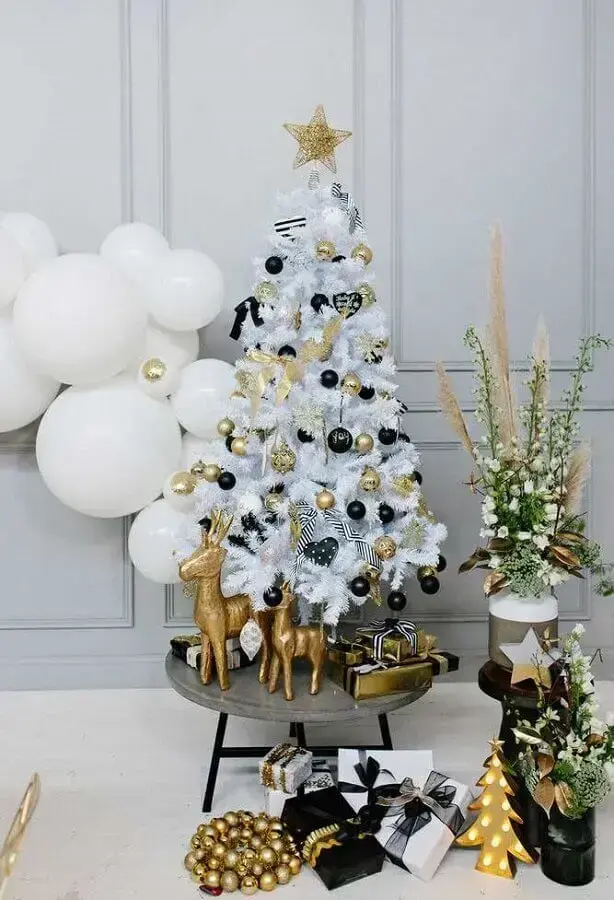 Gold and black ornaments for small white Christmas tree Photo Why Santa Claus