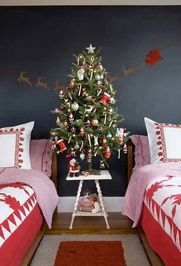 decorated room with small decorated christmas tree Photo Society Letters