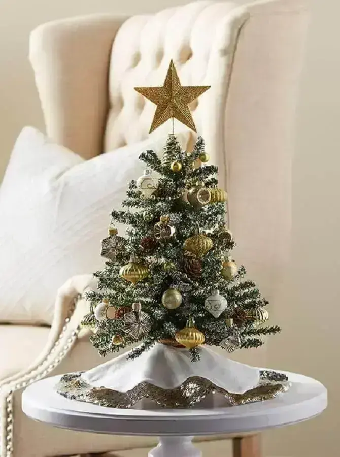Small Christmas tree decorated with silver and gold ornaments Photo Michaels Stores