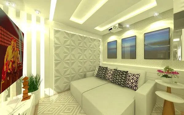 Sala de Tv com revestimento 3D branco, sofá retrátil e almofadas geométricas