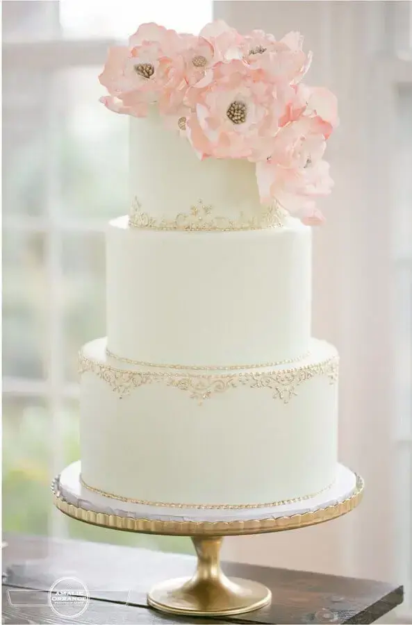 delicate finish for wedding anniversary cake all white 3 floors Photo Save the Bride