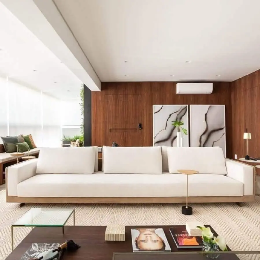 decoração sofisticada para varanda com sofá moderno branco Foto Figueiredo Fischer Arquitetos