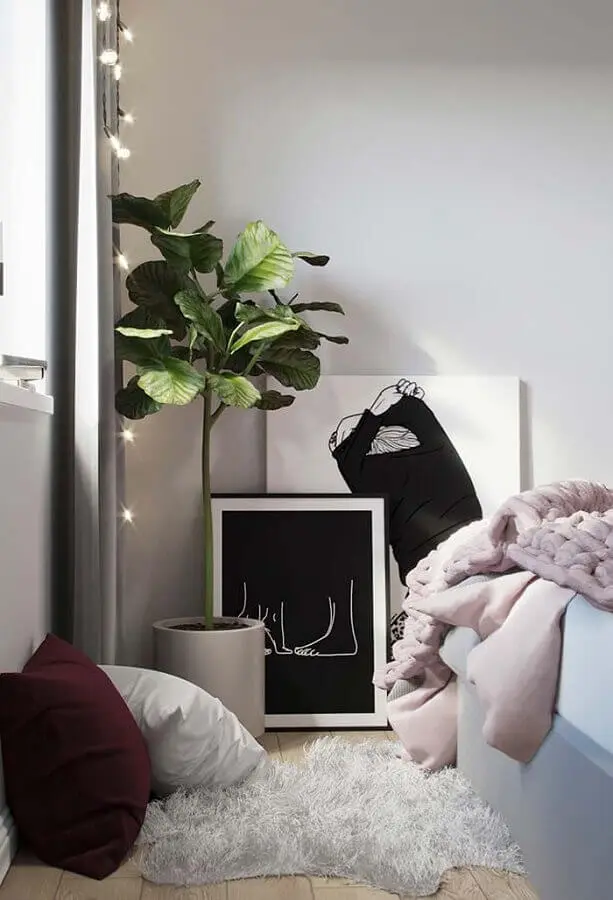quarto decorado com quadro preto e branco no chão Foto Pinterest