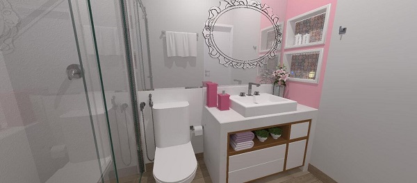 Banheiro rosa e branco com kit de banheiro e parede rosa