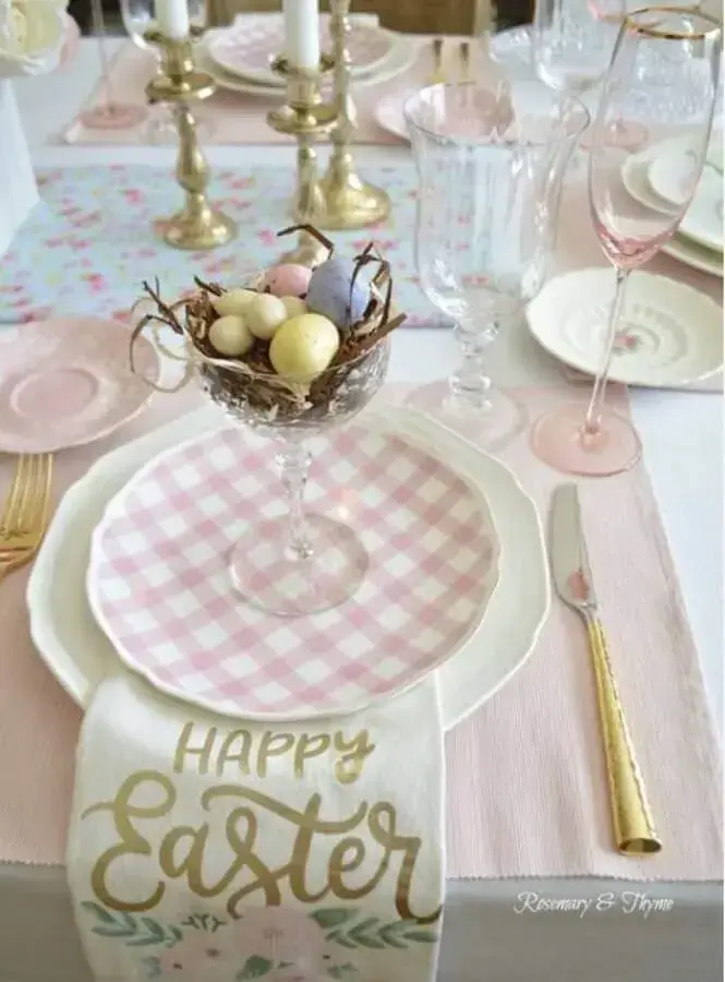 Pink and white Easter tabletop decoration with golden cutlery