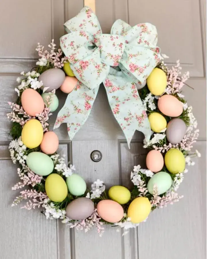 Easter decorations for door with garland decorated with several colorful eggs Photo Simply Easter