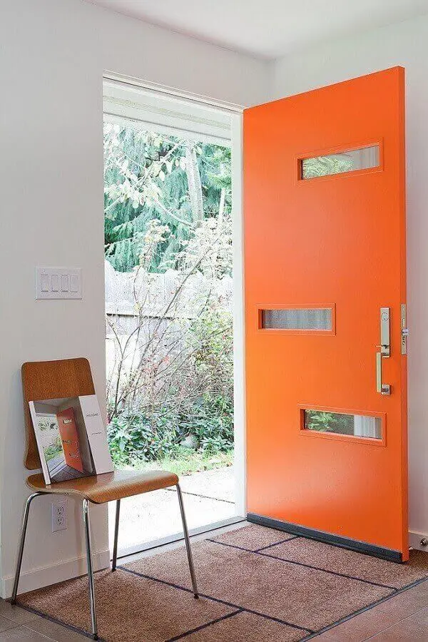 modelo de porta de alumínio para sala pintada de laranja e com recortes de vidro Foto Pinterest