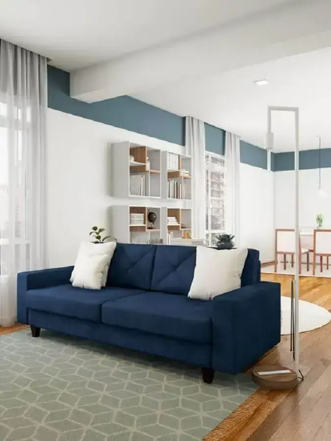 decoração clean para sala com sofá azul escuro Foto Pinterest