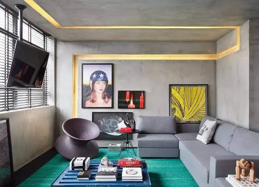 sala moderna decorada com parede de cimento queimado e sofá de canto cinza Foto Pinterest
