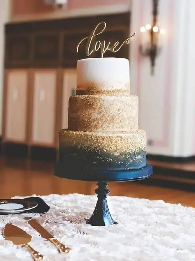 beautiful decorated cake for wedding decoration blue and gold Photo Pinterest