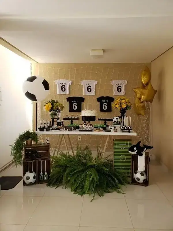 Custom T-shirts can complement the soccer-themed party decoration