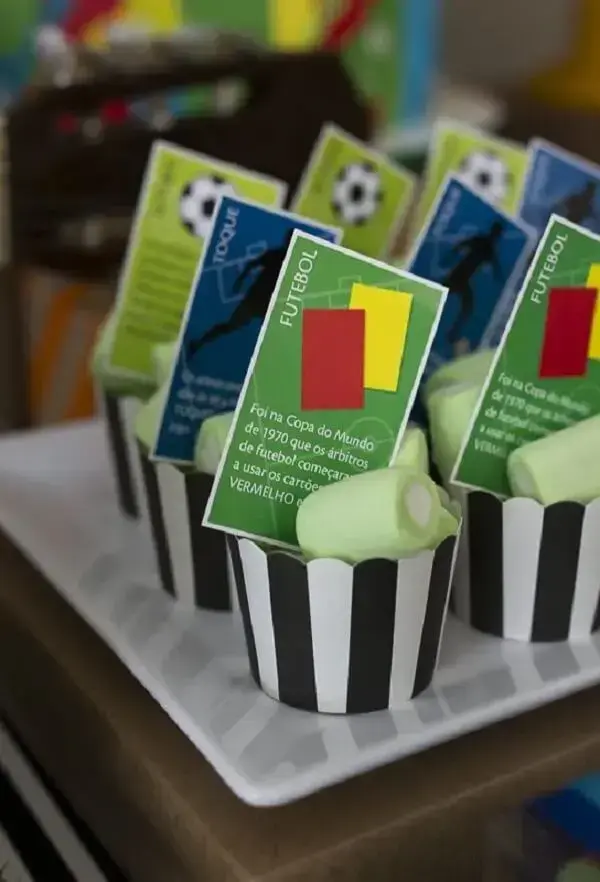 Creative cards decorate the football theme party candies