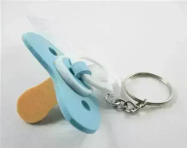 Use creativity and make a keychain EVA pacifier to distribute to guests