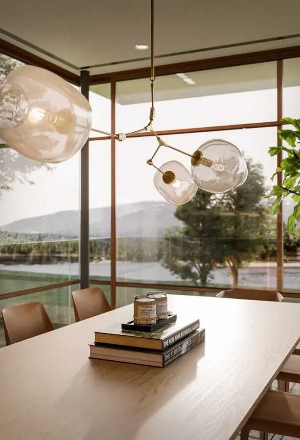 ideia de decoração para centro de mesa de jantar com livros e velas Foto Futurist Architecture
