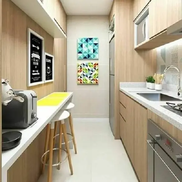 A disposição dos quadros decorativo para cozinha se conectam com o espaço