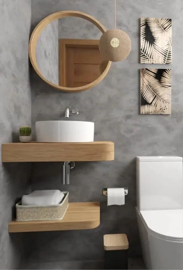 decoração de banheiro cinza pequeno com espelho redondo para banheiro com moldura de madeira Foto Artect Arquitetos