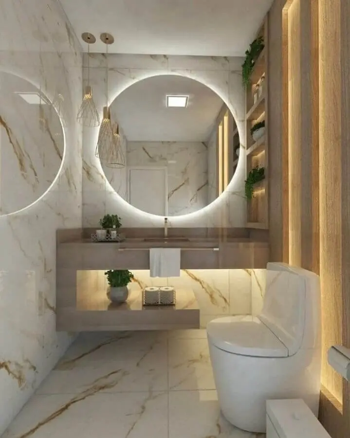 decoração sofisticada com espelho redondo para banheiro com iluminação embutida Foto OKA Arquitetura