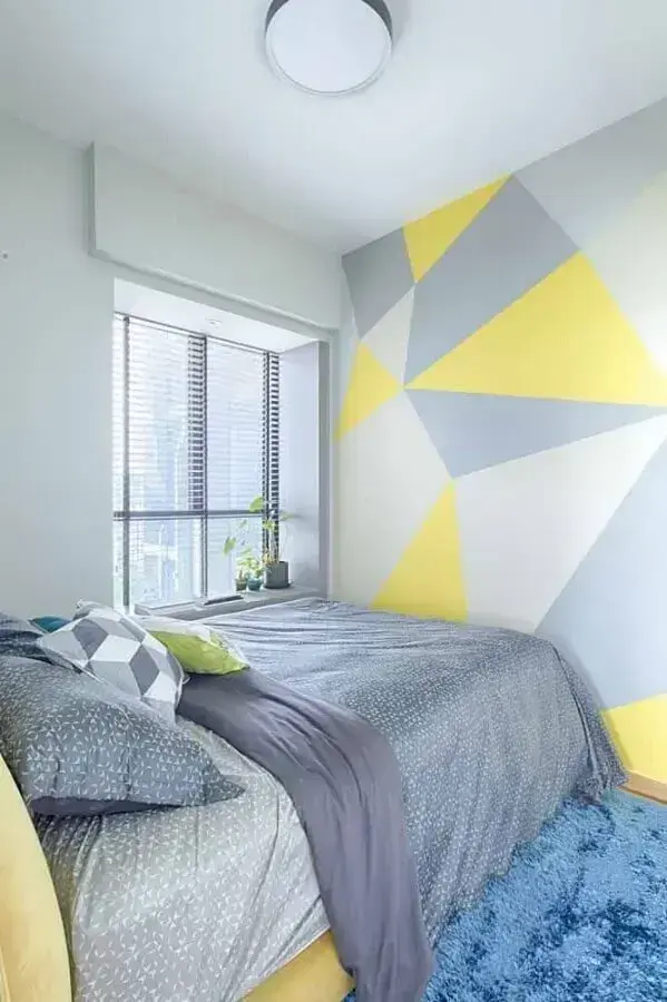 parede geométrica para decoração de quarto azul e amarelo Foto Archidea