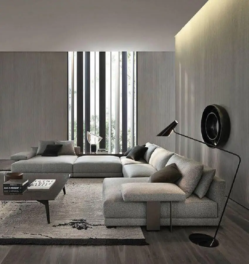 sala cinza moderna decorada com sofá de canto grande Foto Futurist Architecture