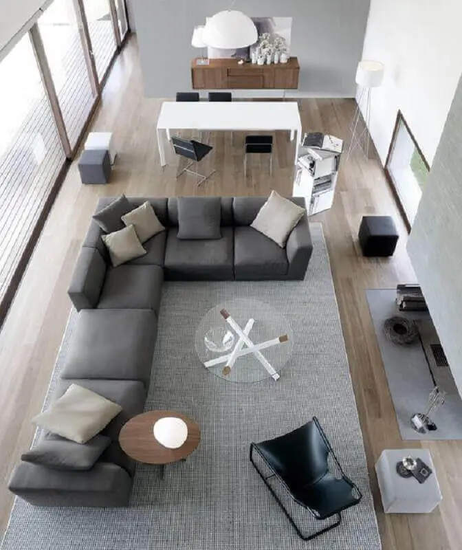 sala cinza moderna decorada com sofá de canto grande Foto TrendeHouse