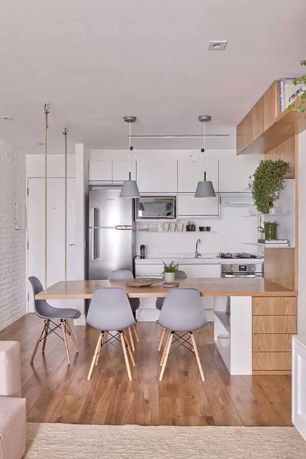 bancada de madeira planejada para decoração de cozinha e sala de jantar integradas Foto VOA Arquitetura