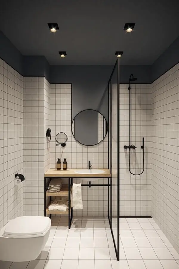 decoração banheiro minimalista com revestimento quadriculado e madeira clara para bancada  Foto Jeito de Casa