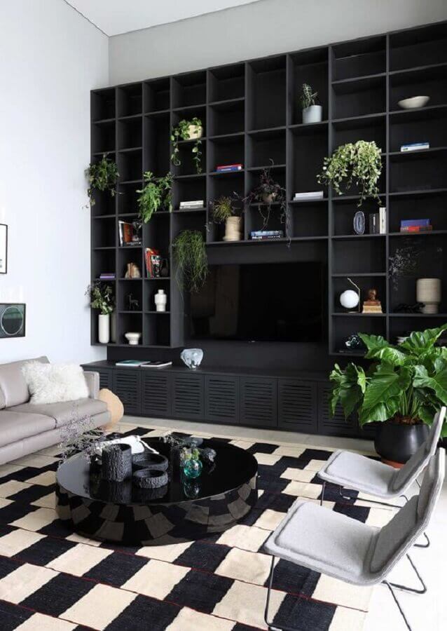 estante de nichos e mesa de centro redonda preta para sala de estar moderna Foto Casa de Valentina